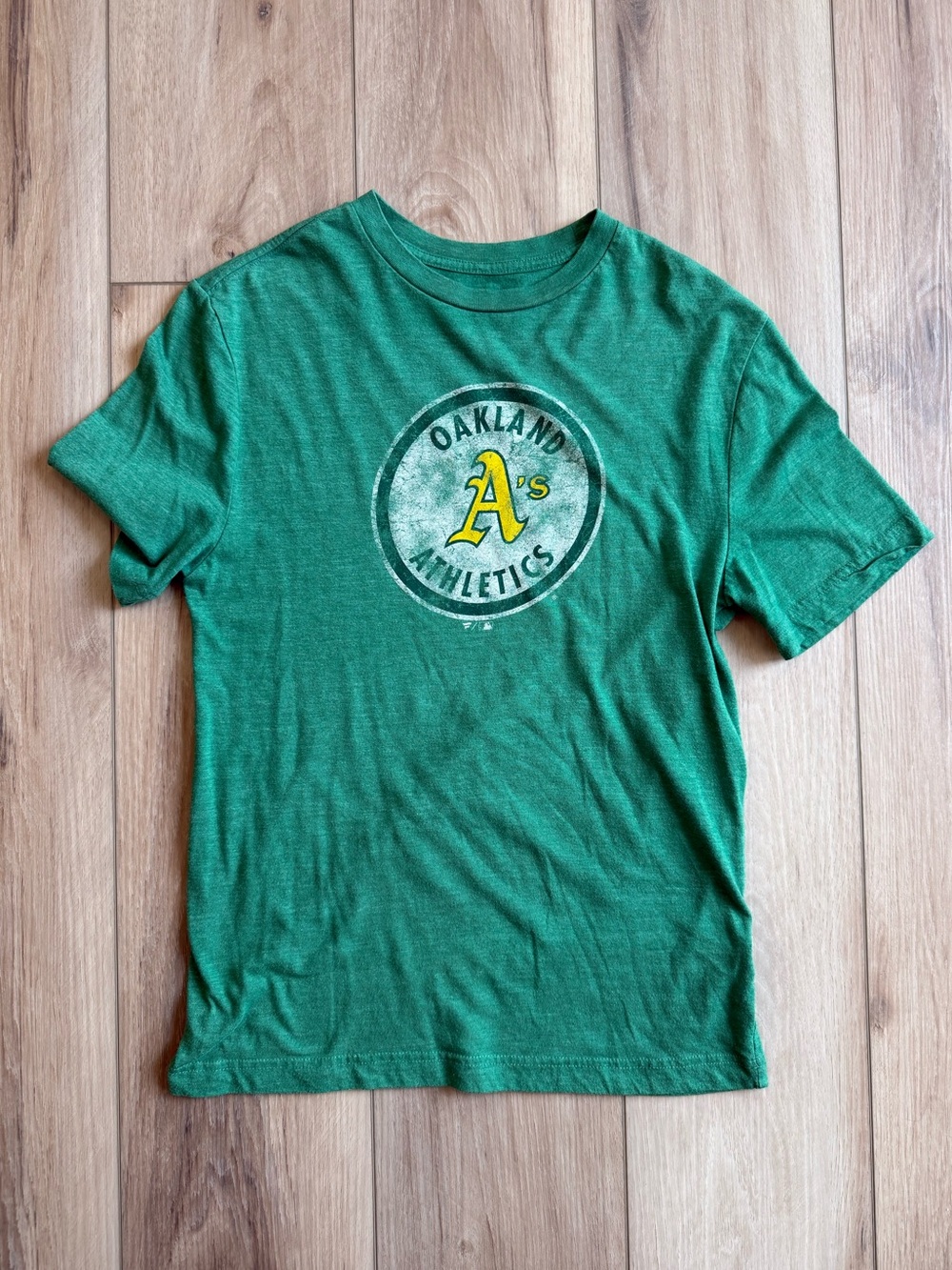 Green Fanatics Oakland Athletics tee with yellow 'A's' logo